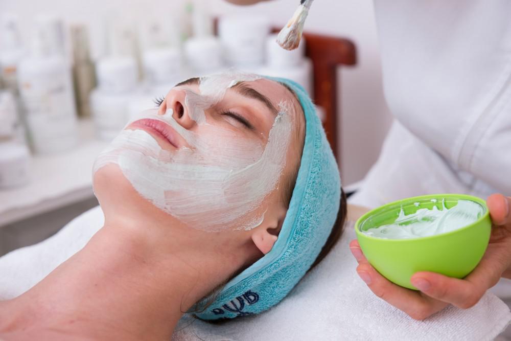 Woman receiving a chemical peel treatment