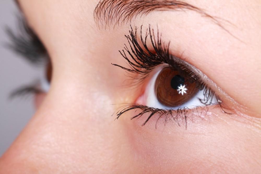 closeup of a woman's brown eyes and surrounding fresh healthy skin