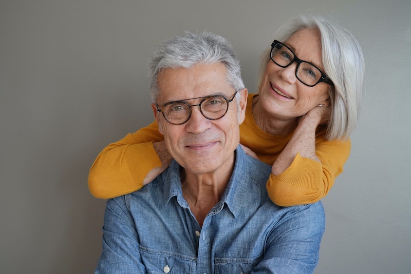Portrait of relaxed middle-aged couple wearing glasses