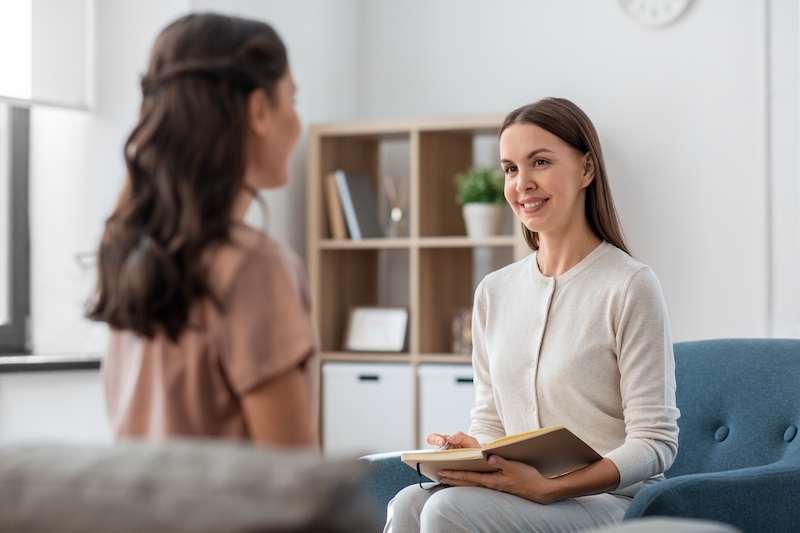 Woman consulting with mental health doctor